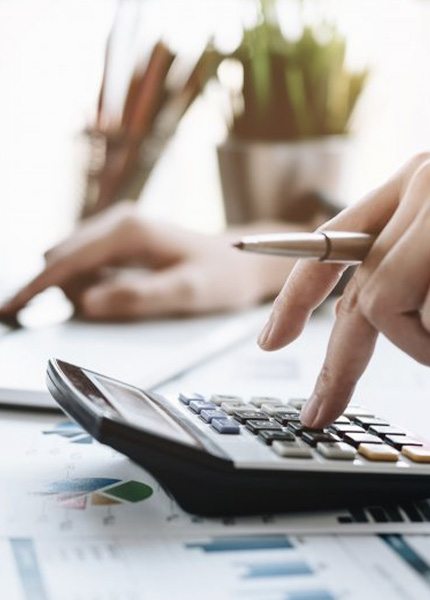 Close up of someone calculating the cost of dental emergencies