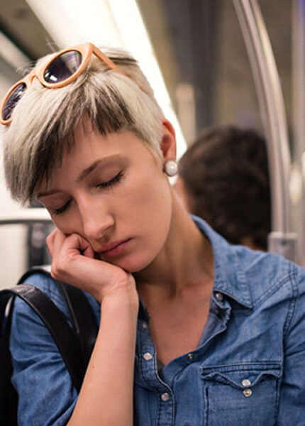 Woman falling asleep on a train