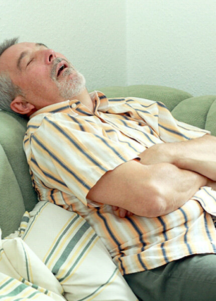 man sleeping on a couch
