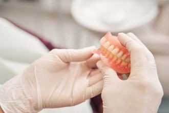 Lab technician creating a set of dentures