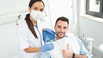 Dental implants patient in South Portland talking to dentist